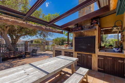 Farmhouse-Outside-Sitting-and-Barbecue-Area